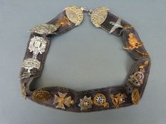 A collection of British Army cap badges to include Argyll and Sutherland Highlanders,