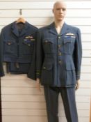 Two RAF officer's uniforms with badges of rank and medal ribbons both with King's crown buttons