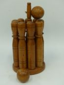 A vintage turned wooden skittles game