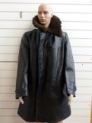 A military pilot's style full length black leather flying coat or jacket with sheepskin collar