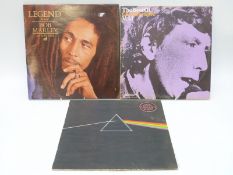 A box of approximately 100 albums of mixed genres,