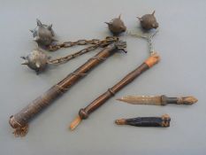 Two replica maces together with an African hunting knife in leather sheath,