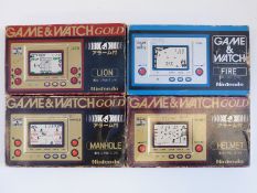 Four Nintendo Game & Watch electronic portable video games consoles, Fire and Gold Lion,