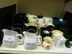 Approximately 28 whisky and other advertising jugs including a graduated set of Tullamore Dew,