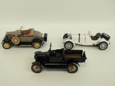 Three Danbury Mint diecast model cars comprising The 1931 Mercedes-Benz SSKL,