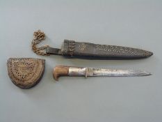 A Victorian British bayonet fashioned into a knife in tooled and riveted leather scabbard together