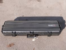 A hard gun flight case with padded interior, 110x40x14cm.