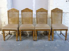 Four upholstered bergere dining chairs