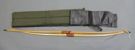 Two wooden laminated longbows,