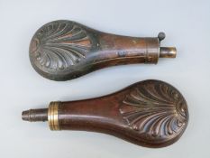 Two copper and brass powder flasks with embossed stylised leaf decoration,