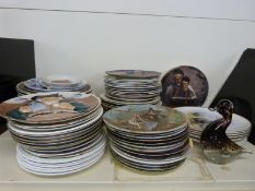 A large quantity of collectors plates including art subjects David Shepherd and Norman Rockwell as