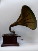 A mahogany cased vintage wind-up concert gramophone with flared metal trumpet