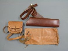 Two leather quivers and a tooled leather bag for accessories