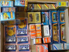Twenty-eight Matchbox and Corgi diecast model vehicles including buses, all in original boxes.