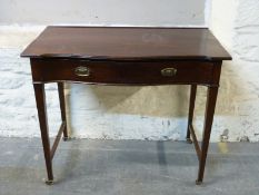 A late 19th/20thC mahogany hall table with single serpentine fronted drawer raised on brass castors,