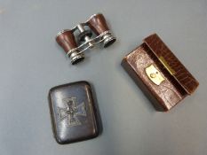 A set of opera glasses and a German military cigarette case