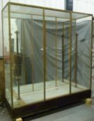 Ex Victoria & Albert Museum early 20thC glazed display cabinet with bronzed frames,