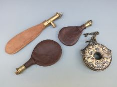 Four various shot and powder flasks,