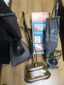 Three vintage vacuum cleaners including a Ladybird together with two Bissell Foam-Master cleaners