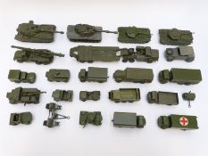 Twenty-three Dinky Toys and Supertoys diecast model military vehicles including tanks, Scout Car,