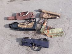 Six various gun slips / cases, some leather and some padded.