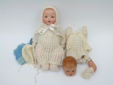 Armand Marseille bisque headed doll with open mouth, weighted blue eyes,