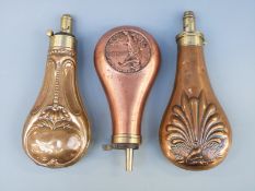 Three copper and brass powder flasks,
