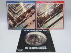 A mixed case of approximately 40 albums, artists include The Beatles, The Rolling Stones,