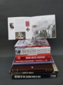 A collection of military books to include a signed copy of 'The Cherry Pickers' 11th Hussars