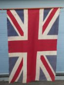 A Union Jack flag on a wooden staff,