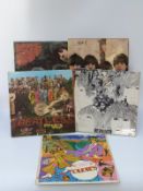 Five The Beatles albums on yellow/black Parlophone, in excellent condition comprising Sgt.