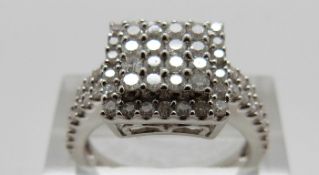 A 9ct white gold ring set with round cut diamonds in a square setting, size O, 4.