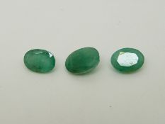 Six oval cut emeralds, the largest approximately 1.