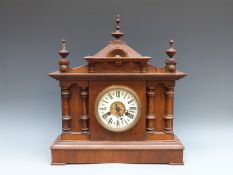 A Continental late Victorian / Edwardian oak cased two train mantel clock,