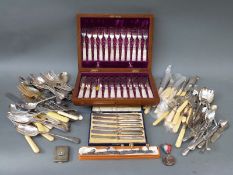 A cased mother of pearl handled dessert service, silver handled butter knives, plated cutlery,