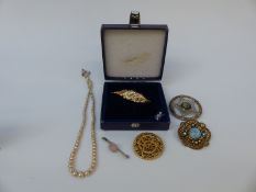 A collection of silver brooches to include one in the form of a leaf,