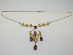 An 15ct gold Edwardian/ Art Nouveau necklace set with seed pearls and amethysts in a floral and