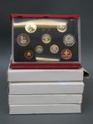Five Royal Mint deluxe proof coin sets for 1985, 1986, 1988, 1990 and 1992,