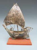 A white metal ship on stand, marked to keel silver 925, height of ship 18cm,