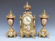 FHS of Germany brass and ceramic clock garniture in the Sevres style,