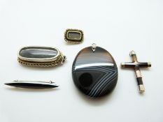 A Victorian banded agate cross pendant with yellow metal fittings, a large banded agate pendant,