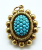 A Victorian yellow metal brooch/ pendant set with turquoise cabochons