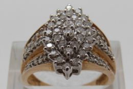 A 9ct gold ring set with diamonds in a cluster, size P,
