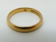 A 22ct gold wedding band, 4.
