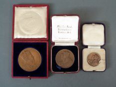 Three cased bronze Coronation medals to include two for George VI and an Edward VII example