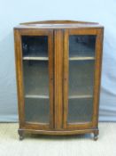 A glazed oak bookcase,