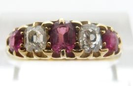 An 18ct gold Victorian ring set with alternating rubies and diamonds, the diamonds approximately 0.