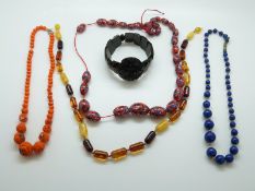 A Victorian jet bracelet, millefiori glass beaded necklace,