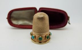A 15ct gold Victorian thimble set with circular turquoise cabochons,