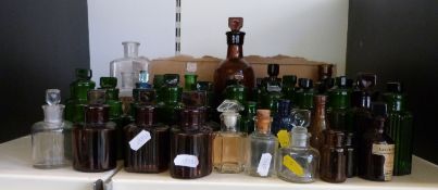 A collection of small vintage bottles including poison